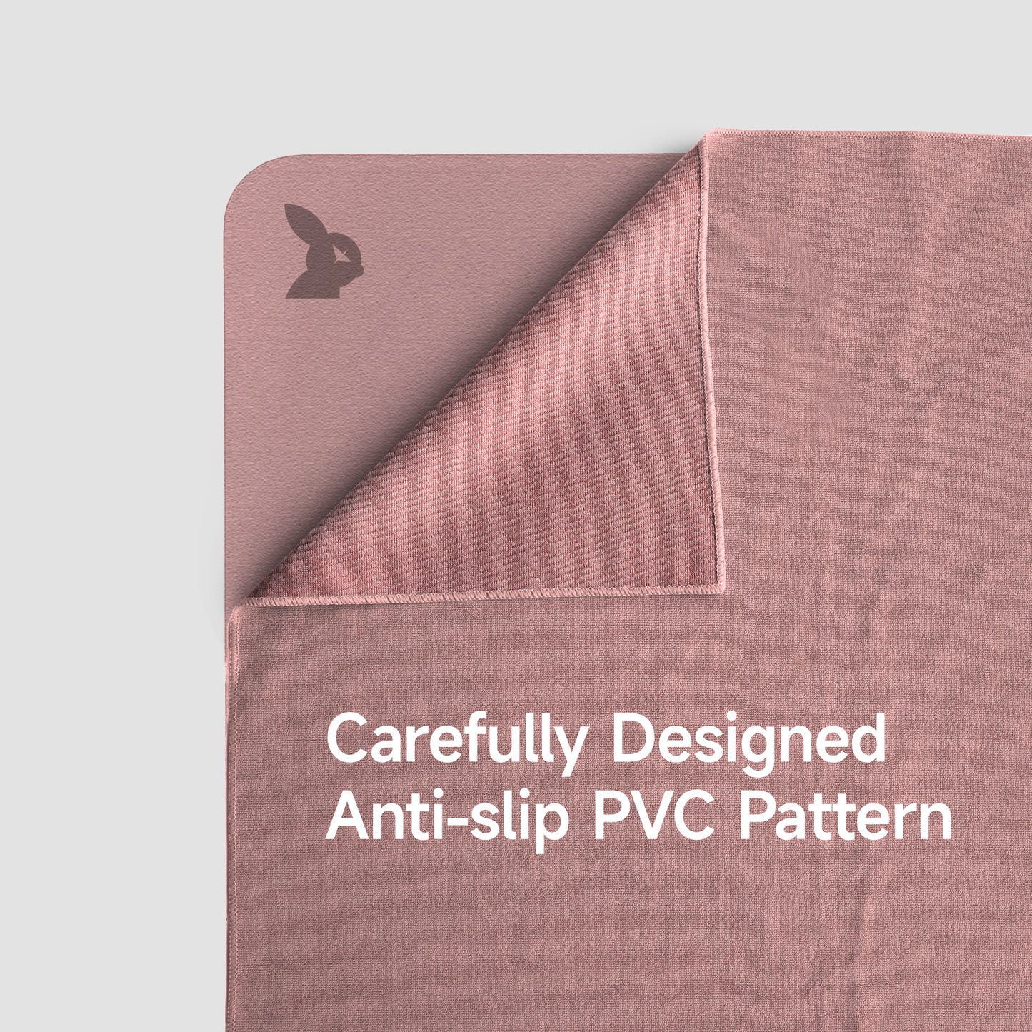 Pink textured mat with anti-slip PVC pattern on a light gray background