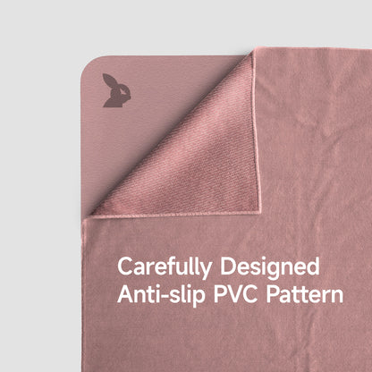 Pink textured mat with anti-slip PVC pattern on a light gray background